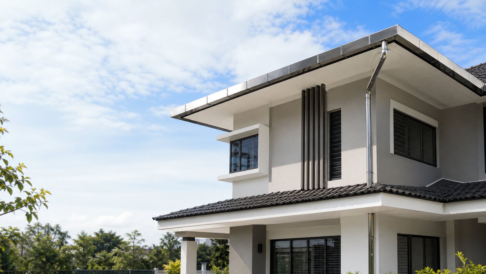 Finished stainless steel gutter on a renovated residential home